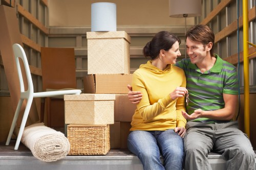 Household furniture and boxes being prepared for storage collection